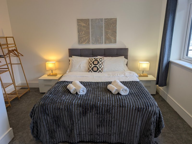 A bright and spacious king-size bedroom. The room is tastefully finished with modern décor and benefits from a large window and ensuite.