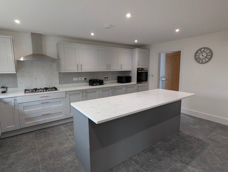 Modern, well-equipped kitchen with plenty of workspace and storage, making it easy for larger groups to prepare meals and keep everything organised during their stay.