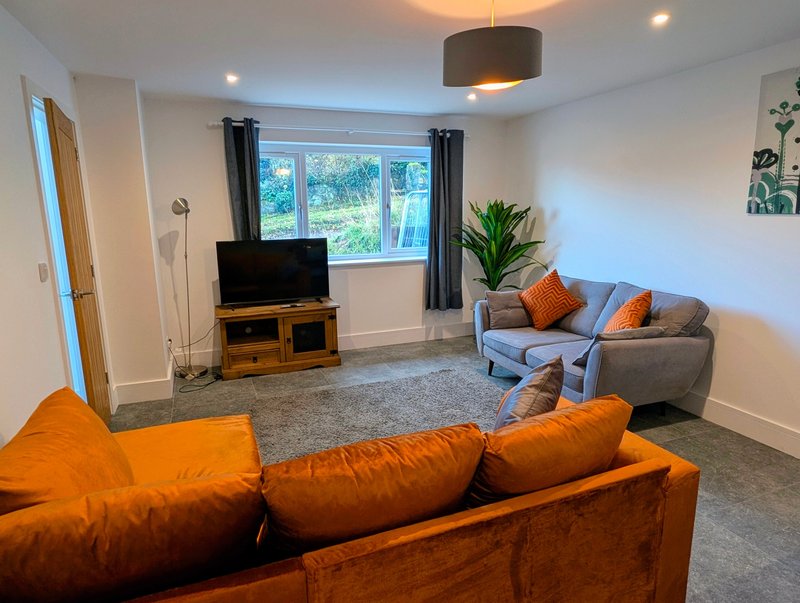 A comfortable second living space with generous seating, a Smart TV and plenty of room to relax.