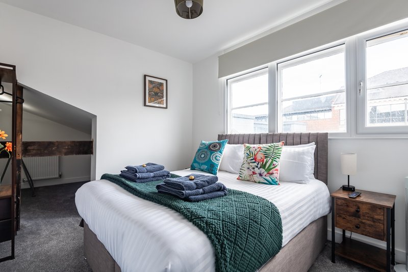 Two flexible bedrooms — king or twin beds, blackout blinds, Smart TVs, premium mattresses