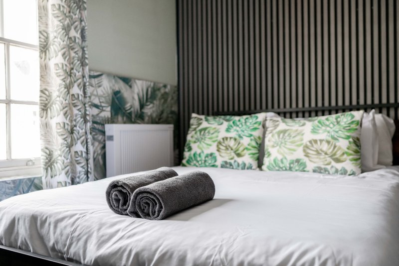 Thoughtfully prepared bedroom with fresh linen and soft bedding.