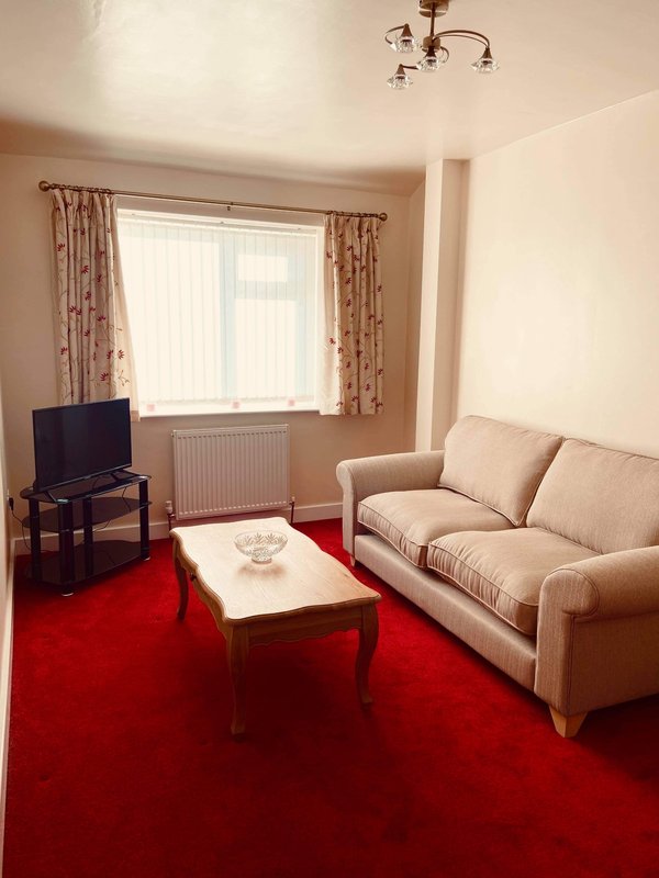 Second lounge with sofa, two chairs and a 32inch smart Fire TV