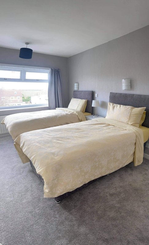 Double room with two single beds, fitted wardrobes and 32inch smart TV