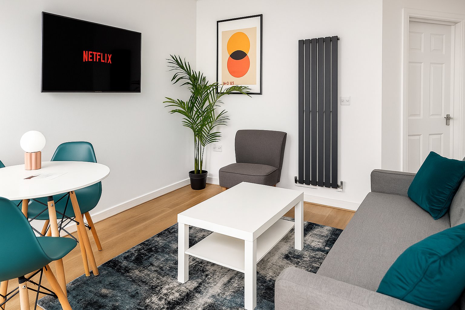 Modern living room with sofa, dining table, wall-mounted TV, and contemporary decor