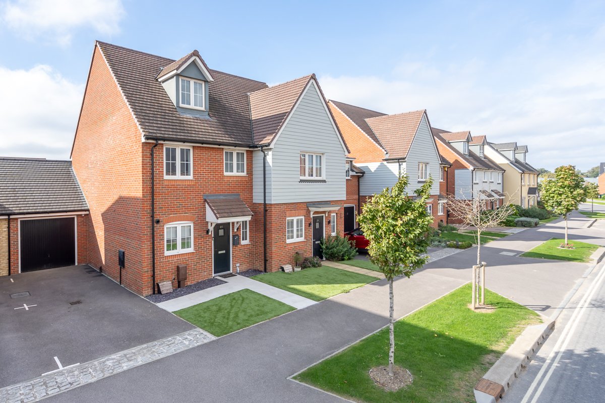 Townhouse with 4 bedrooms plus a study. Drive to side has parking for two vehicles.