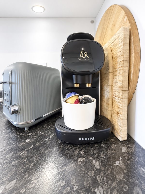 Nespresso coffee machine with some 'original' pods for when you arrive.