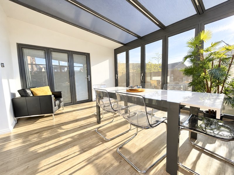 The dining area has bi-fold doors which make the garden feel part of the house during the warmer months when they are open. Access to bedroom 4.