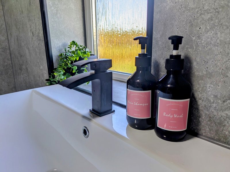 Thoughtful bathroom essentials are provided, including complimentary toiletries such as shampoo and body wash, along with fresh towels for your stay.
