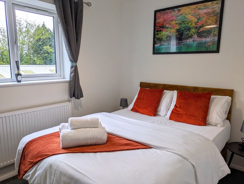A comfortable double bedroom offering a quiet and restful space. With a quality double bed, fresh bedding and towels, and plenty of natural light.