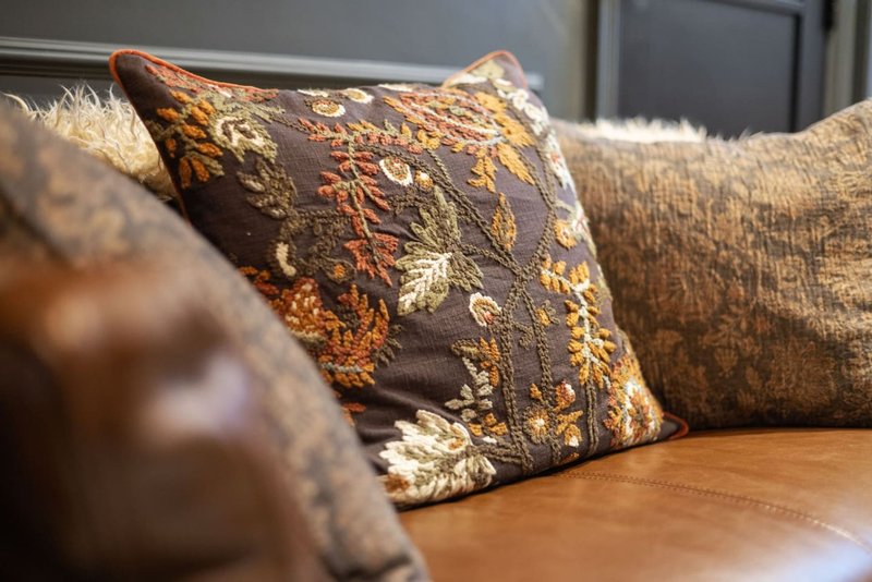 Living room sofa with decorative cushions and warm lighting