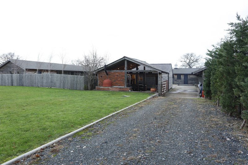 Plenty of private parking – with a large gravel driveway offering ample space for multiple vehicles and work vans.