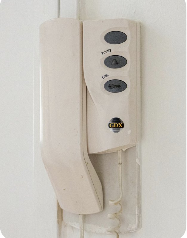 Wall-mounted cream-colored electric kettle with GDX branding and control buttons
