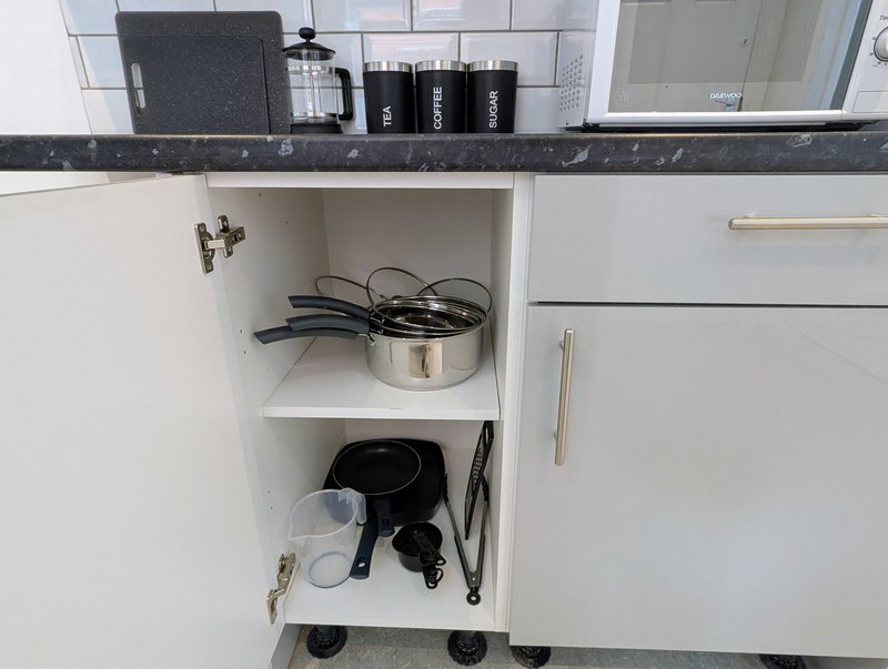 A practical kitchen stocked with essential cookware, utensils and everyday essentials, making it easy for contractor groups to prepare meals during their stay. Tea, coffee and sugar are also provided.