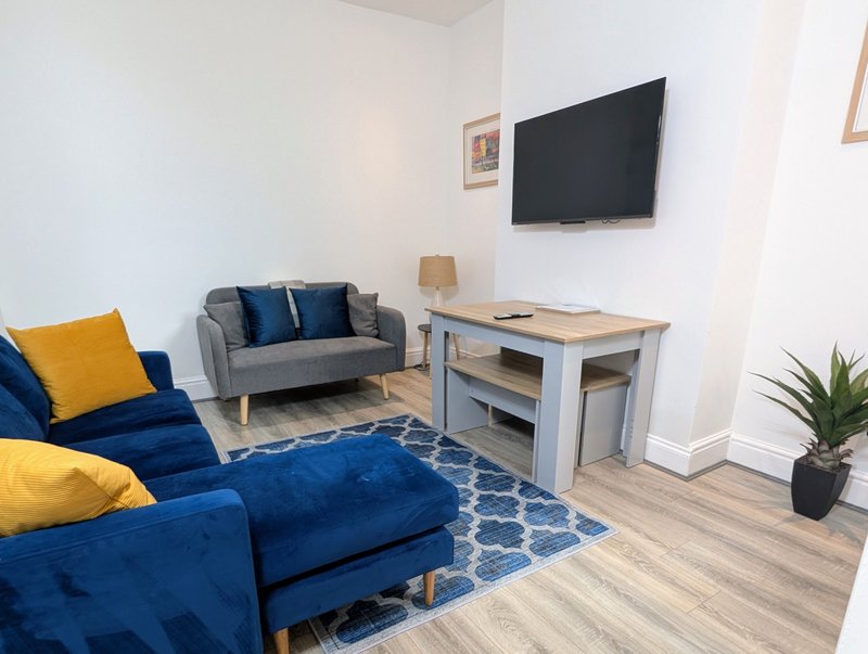 A practical dining area within the open living space, providing a comfortable spot for contractors to eat meals together. The table is also useful for planning the working day and catching up.
