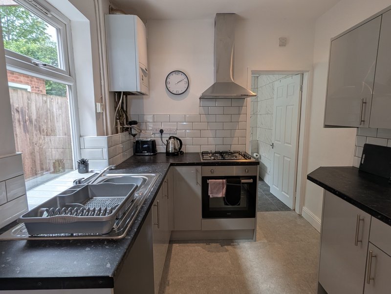 A well-equipped kitchen with everything contractors need for a comfortable stay, including a gas hob, oven, fridge/freezer, microwave, kettle and toaster.