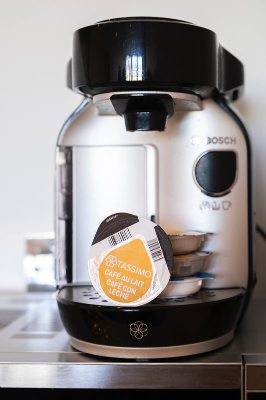 Bosch coffee maker with branded pod capsule on kitchen counter
