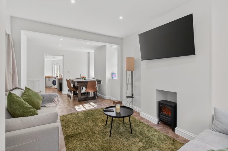 Spacious open-plan lounge with comfortable seating, 55-inch Smart TV and dining area, giving contractor teams plenty of space to relax after work. Double sofa bed provides additional sleeping capacity