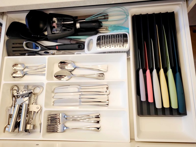 Kitchen drawer organizer with cutlery, cooking utensils, and writing implements