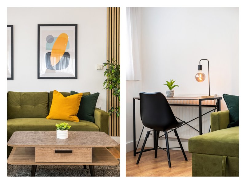 Modern living room with olive-green sofa, wooden coffee table, desk area with black chair and pendant lamp