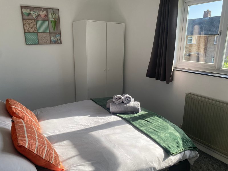 Bright bedroom with double bed