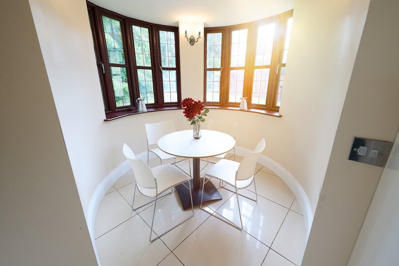 The smallest of several dining spaces, offering a bright and comfortable spot for smaller groups. With natural light from the surrounding windows, it’s ideal for relaxed meals.