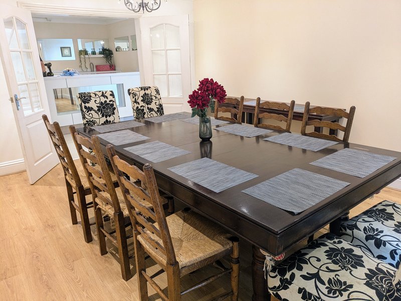 The property’s largest dining area features a substantial dining table with seating for up to 10 guests, making it ideal for group meals and entertaining.