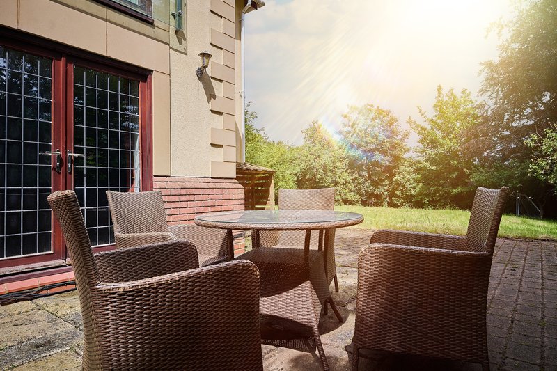 Enjoy alfresco dining in the largest of the property’s three dining spaces, with a spacious outdoor table and chairs and a BBQ.