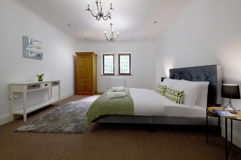 A spacious, well-presented bedroom offering a comfortable space after a long working day. Finished with quality bedding and ample storage.