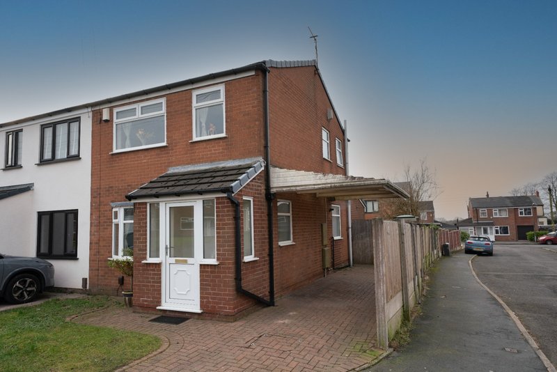 Brick semi-detached house with driveway, front garden and white door