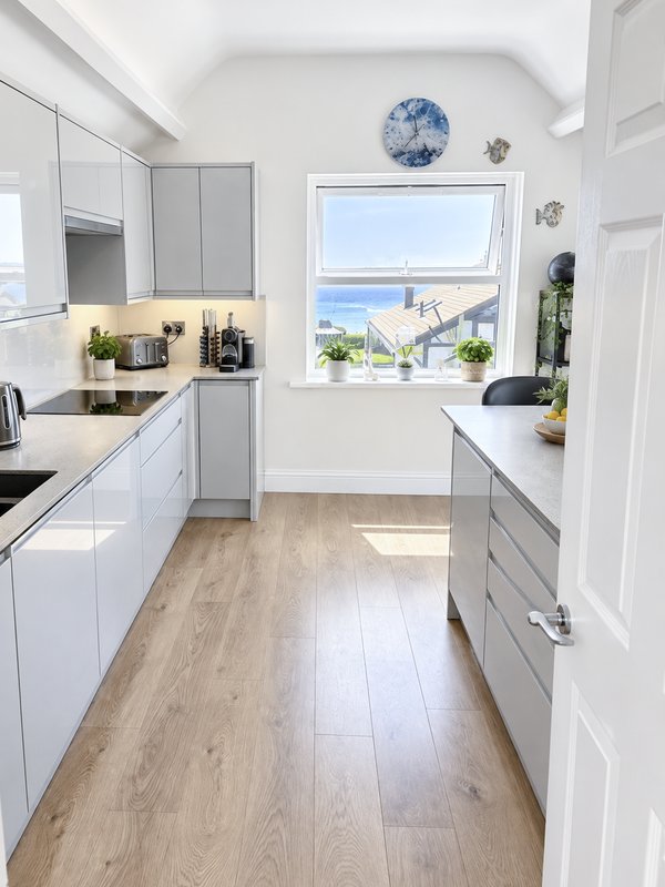 Tranquil kitchen with breakfast bar and amazing sea views