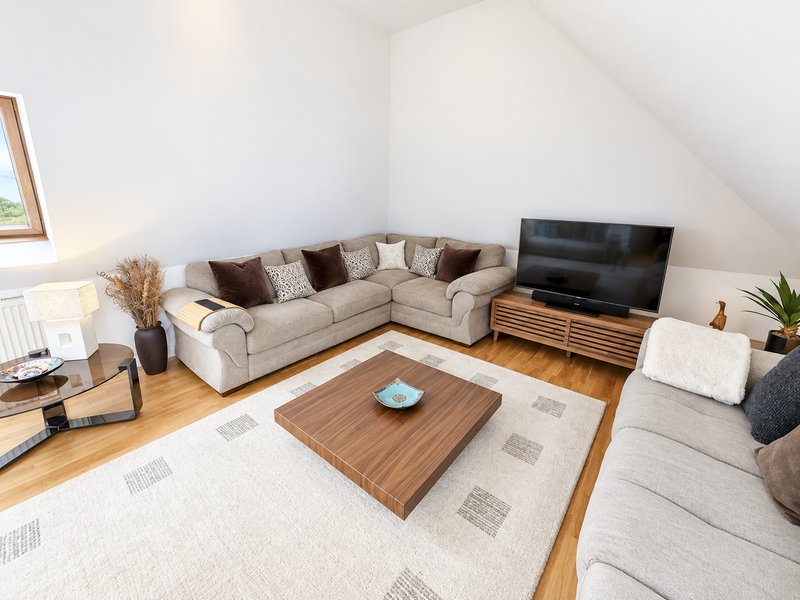 Large lounge with three settees and smart TV to connect to all your favourite apps