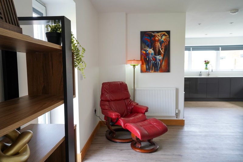 A comfortable additional seating area provides a quieter spot to sit back and relax after a busy day at work.
