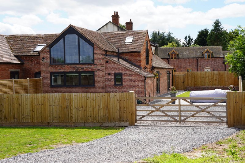 A spacious and attractive converted barn-style property offering ample private off-road parking, making it particularly well suited to contractors and working groups travelling with multiple vehicles.