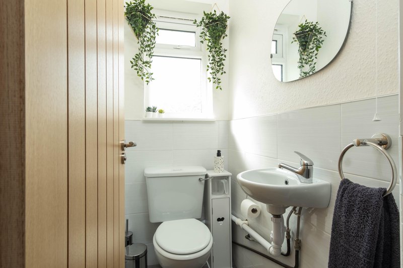 Separate toilet next to bathroom.