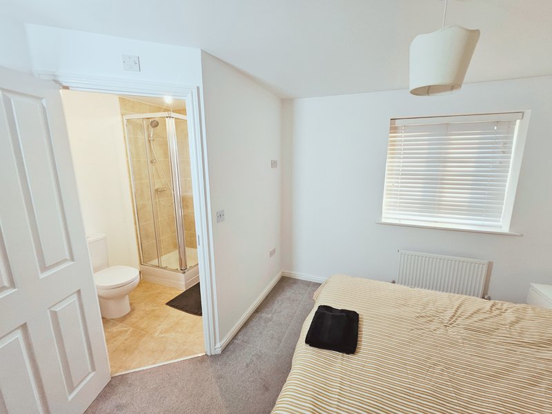 Master bedroom with ensuite bathroom with shower enclosure