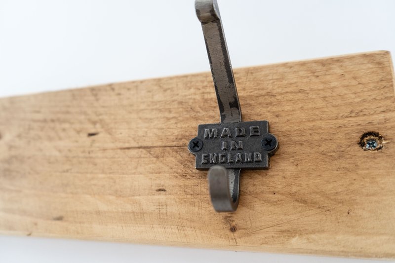 Wooden coat hook with cast iron vintage 'Made in England' hook detail