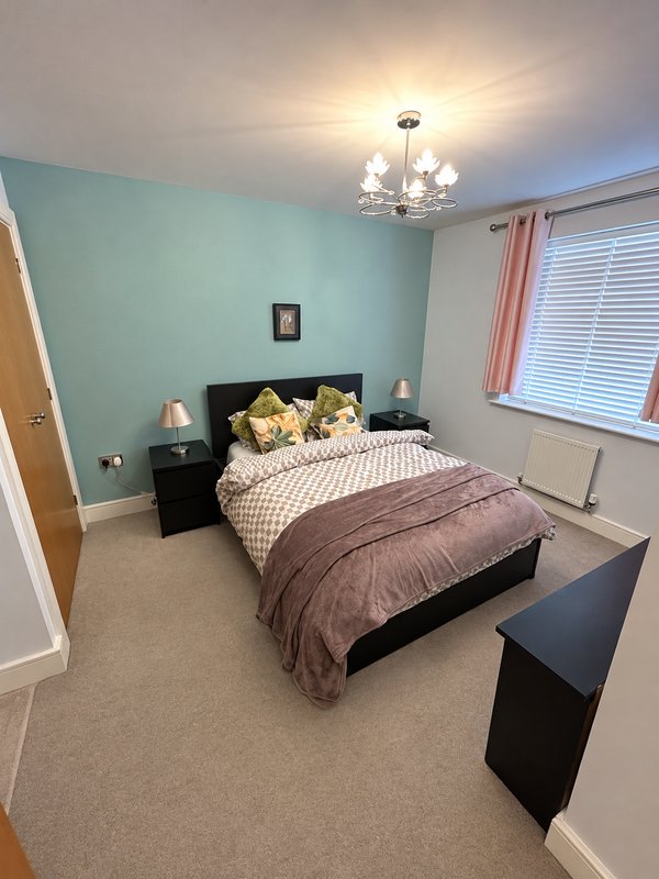 Bedroom with a double bed and an in-built wardrobe