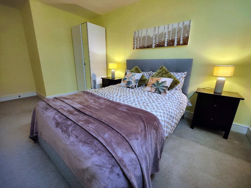 Bedroom with an ottoman double bed with plenty of storage space
