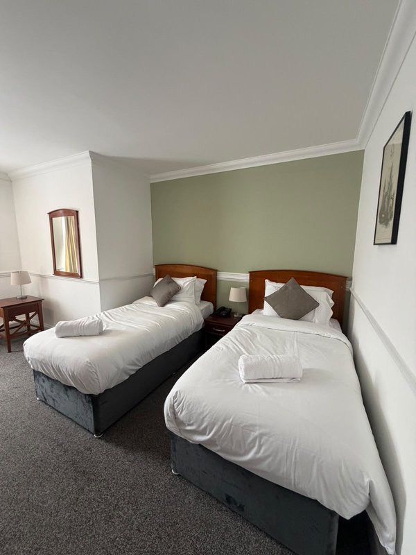 Our Economy Double or Twin Room is ideal for up to two guests. It offers a double or twin bed setup, private bathroom, Smart TV, fast Wi-Fi and tea and coffee facilities. Room layouts may vary.