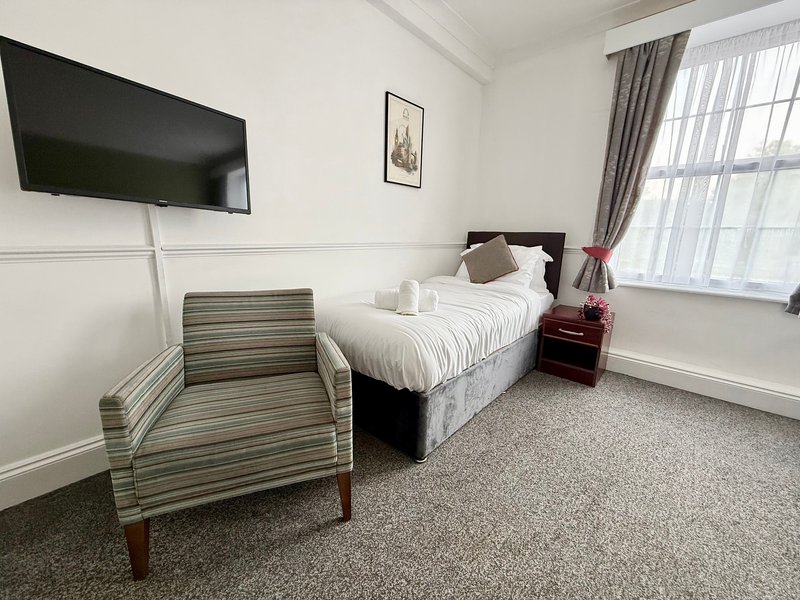 Relax in our spacious Triple Room, ideal for up to three guests. It offers three single beds, a private bathroom, Smart TV, fast Wi-Fi and tea and coffee facilities. Room layouts and décor may vary.