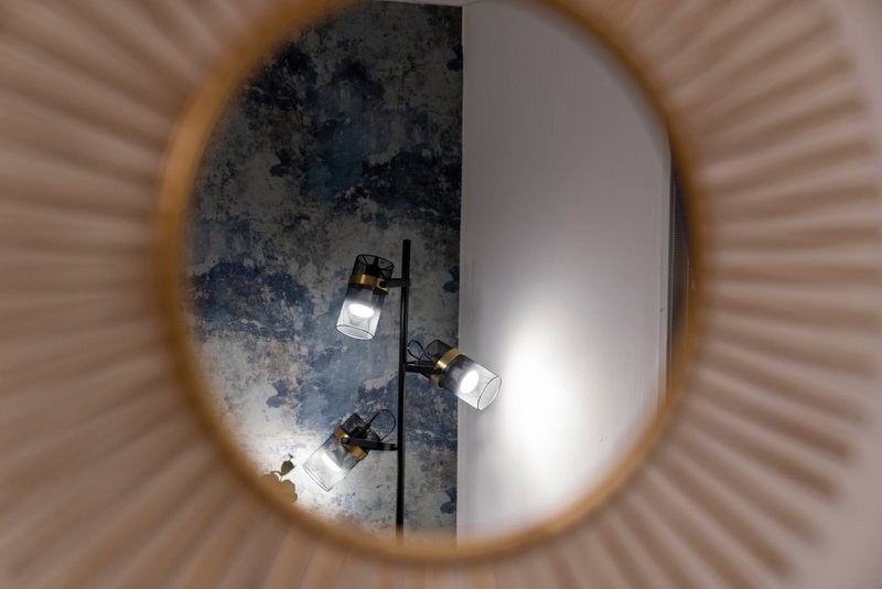 Overhead view of ceiling with track lighting fixtures and textured white finish