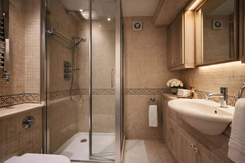 Modern bathroom with walk-in shower, pedestal sink, toilet and heated towel rail