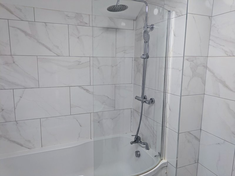 Complimentary toiletries and fresh towels are provided, adding an extra touch of comfort for guests staying away from home.