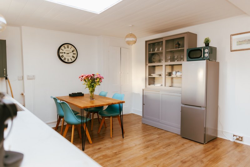Kitchen/diner has an electric oven, gas hob, microwave, kettle, toaster and Nespresso coffee machine. Dining table seats 4. There are washing machine, iron, pegs and clothes airer