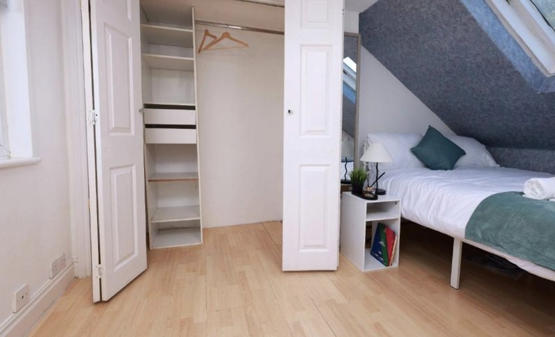 Built-in wardrobe in bedroom 4 with double bed.