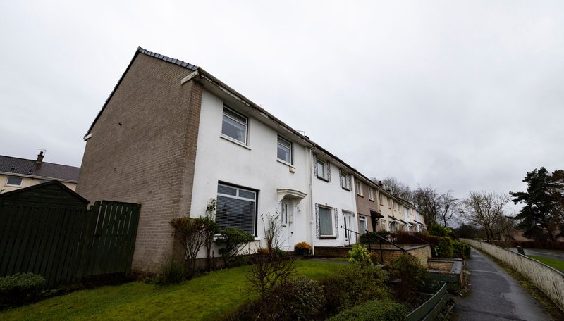 Semi-detached house exterior with brick and rendered walls, front garden and driveway