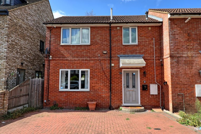 Red brick semi-detached house with driveway, front door and two windows