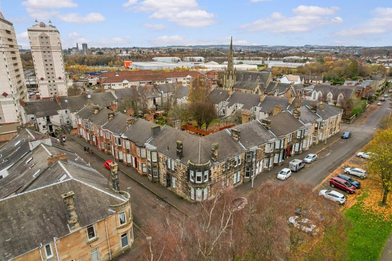 Aerial view of residential neighborhood with Victorian terraced houses, streets, and autumn foliage