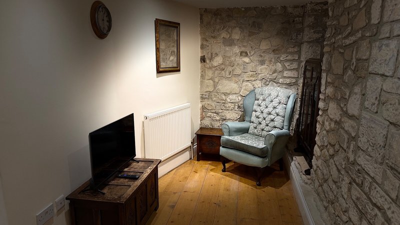 large room with double bed private bathroom separate seating area, tv, fridge, tea and coffee facilities, large ensuite bathroom with walk in shower, private enclosed garden