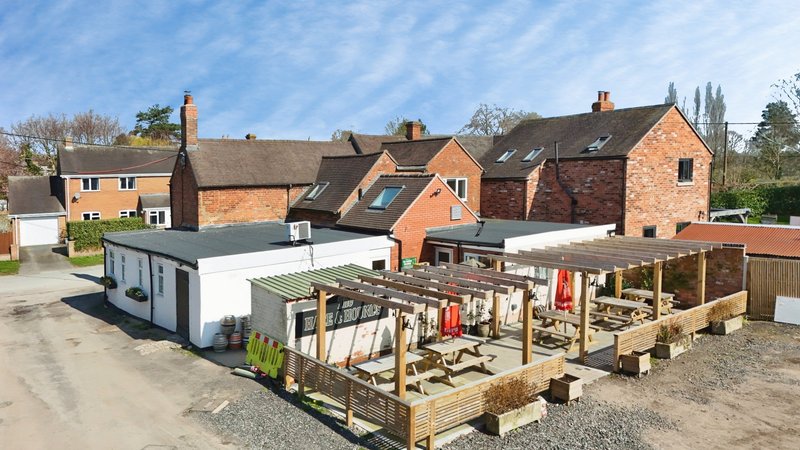 situated above a welcoming village pub, offering guests the convenience of having food and drinks right on their doorstep.